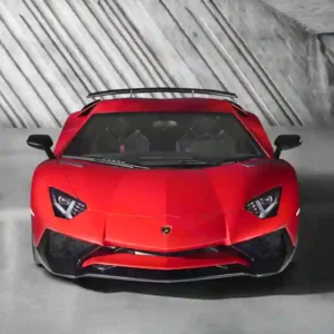 Lamborghini Aventador SV Red color and behind a cement wall with stripes
