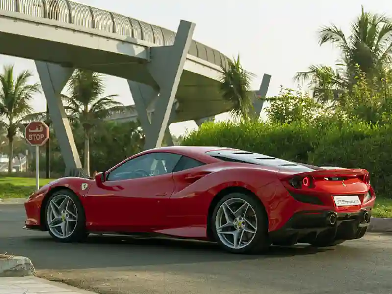 Red Ferrari crossing the bridge