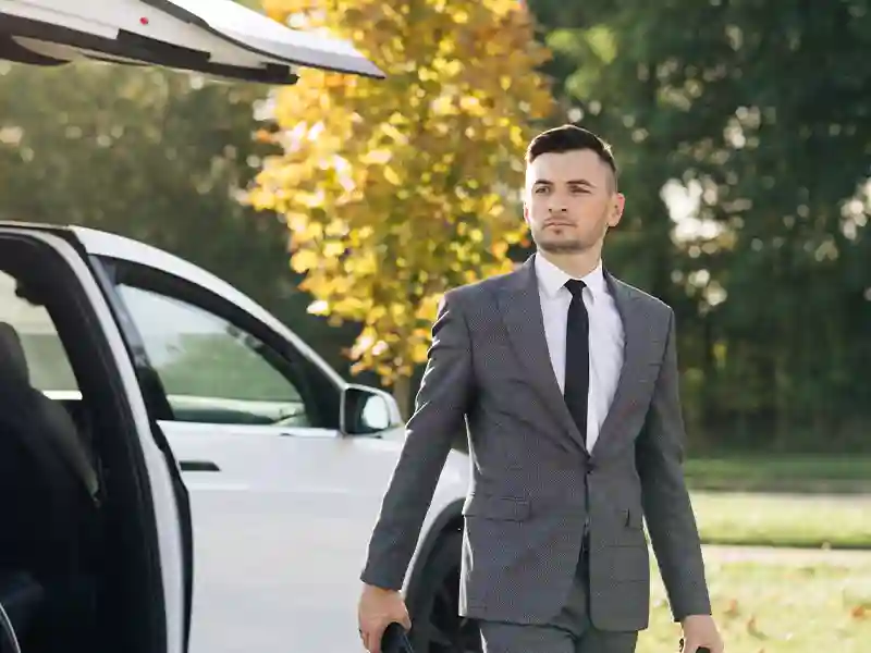 Man coming out of the Tesla Chauffeur Service
