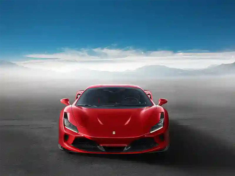Red Ferrari F8 with a great sunset background