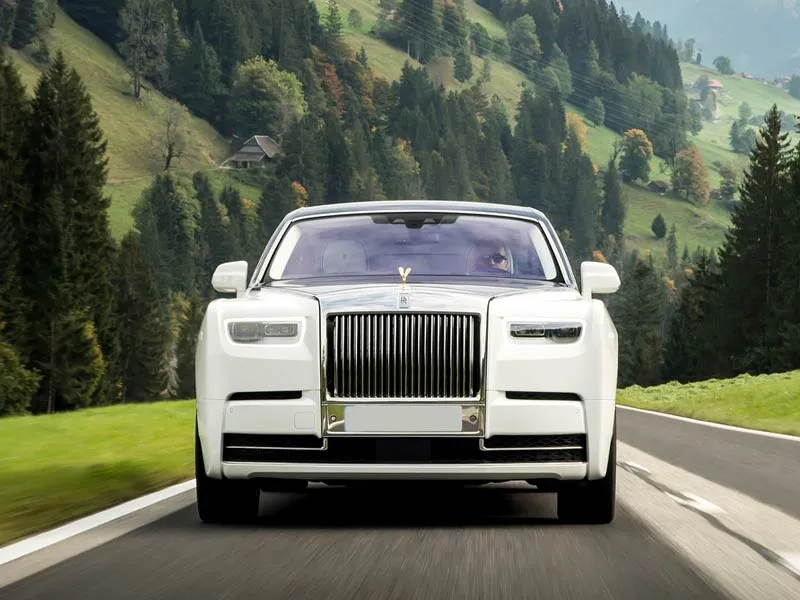 White Rolls-Royce on the road