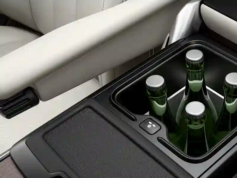 Back seat of the Range Rover Vogue with 3 bottles of soda water