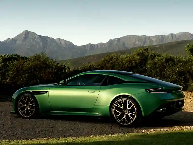Green Aston MArtin DB12 on the road
