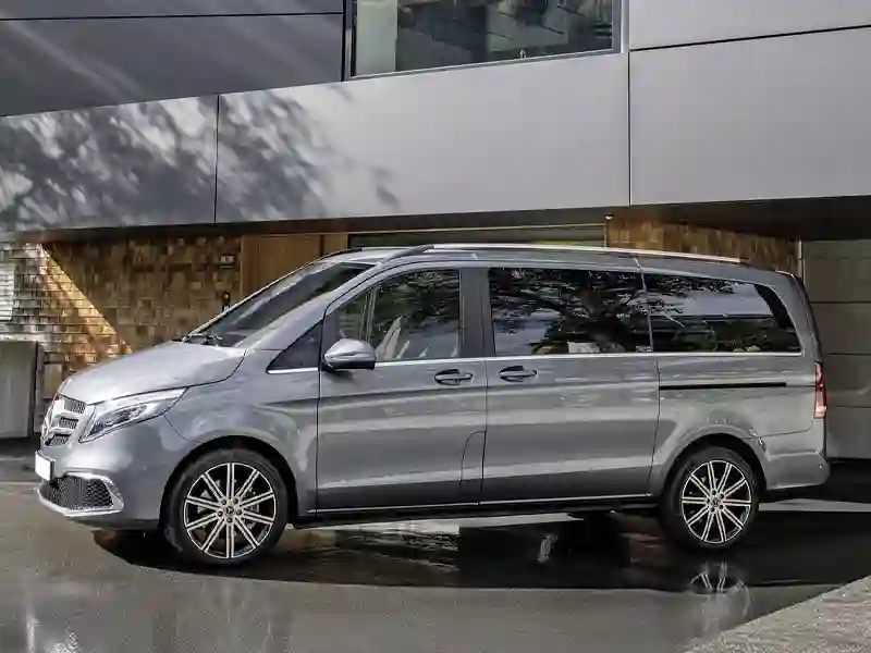 Mercedes Benz V Class grey colour outside of a house