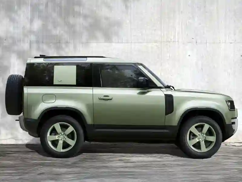 Side view of the green colour Land Rover Defender