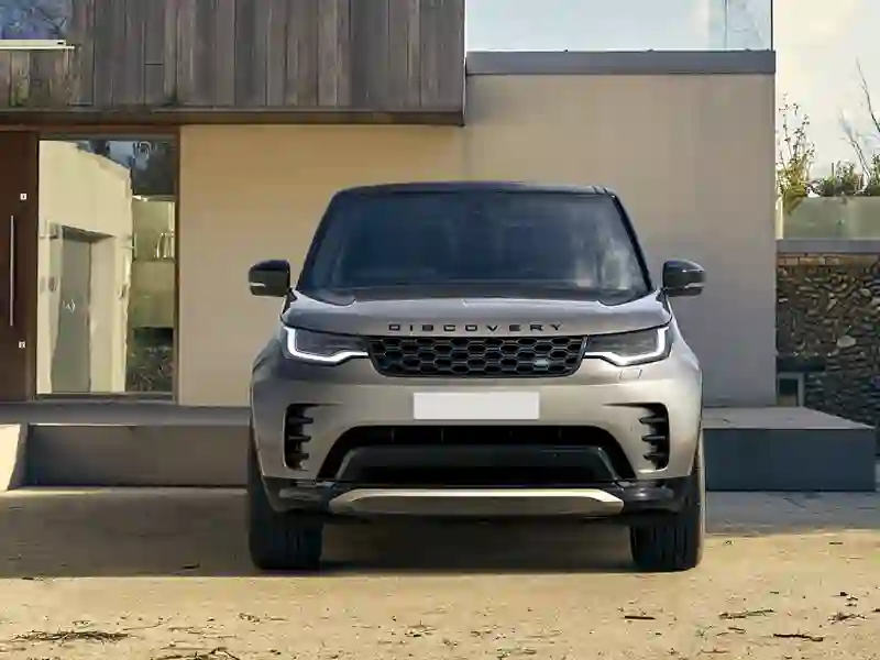 Land Rover Discovery grey colour outside of a house