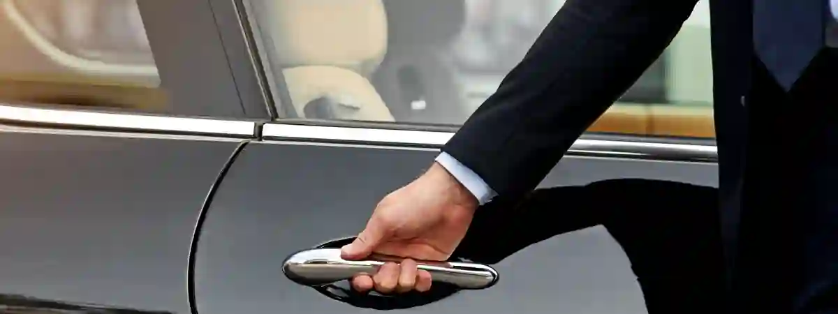 Elegant Chauffeur opening door