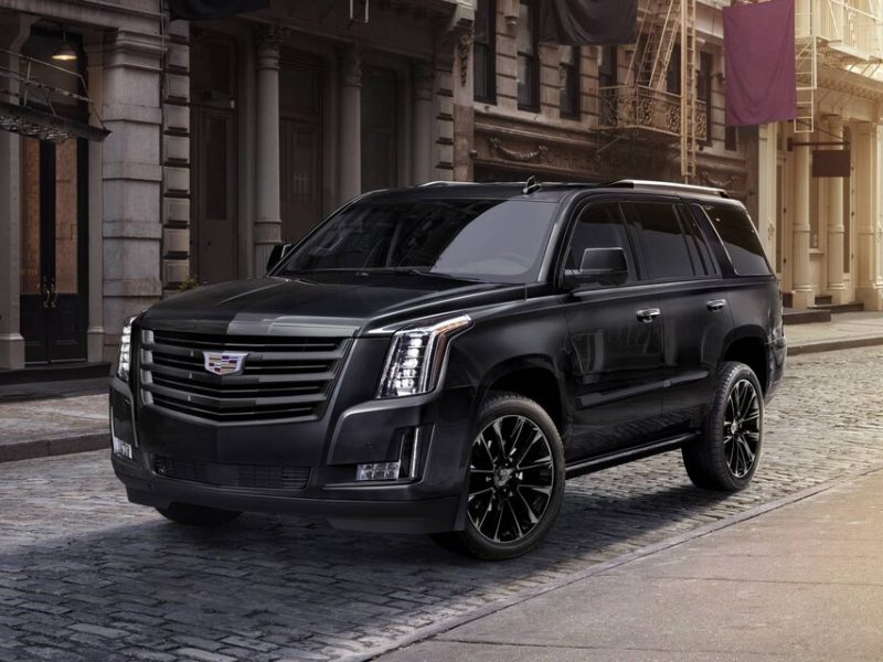 CADILLAC ESCALADE PLATINUM black parked