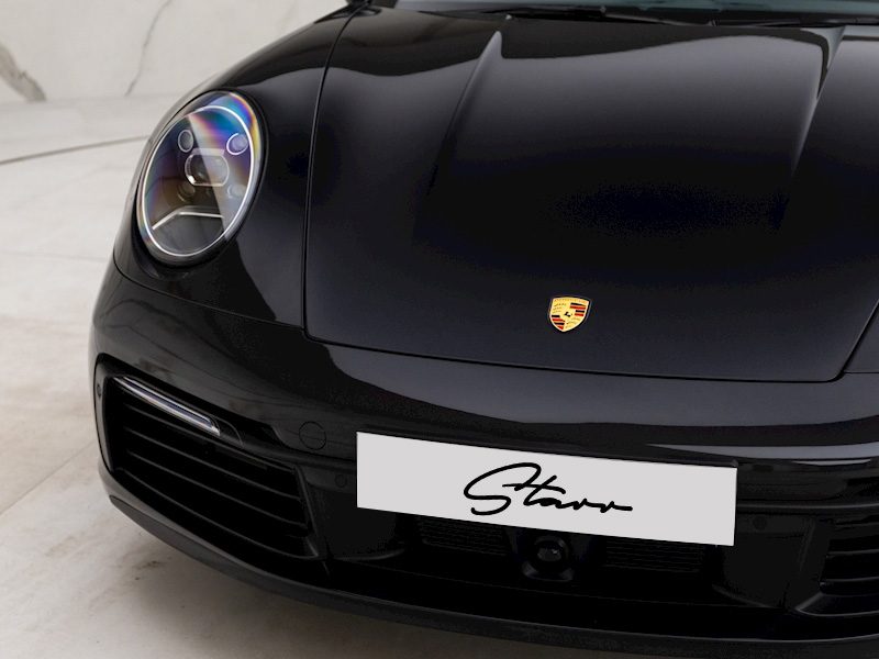 Porsche 911 Carrera crest close up