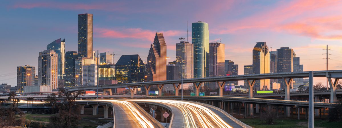 Houston, Texas, USA downtown skyline over the highways at dusk.
